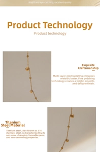 Detailed view of polished 18K gold plated stainless steel bead chain with long tassel