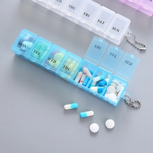 Portable 7-day pill box in translucent blue with weekly labels and hanging bead chain