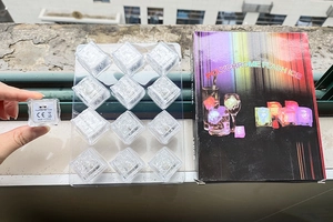 Detail view of 12pcs LED glowing ice cubes with CE certification and retail packaging