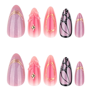 Short almond press-on nails with pink gradient butterfly wing texture and 3D star charms
