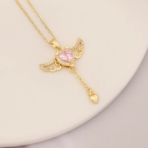 Detailed view of pink heart butterfly pendant necklace with 18k gold plating