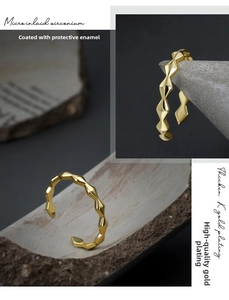 Macro shot of geometric gold plated ring showing microinlaid zirconium and k gold layers