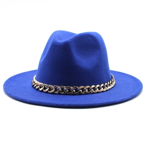 Detailed view of royal blue fedora hat with elegant gold metal chain decoration