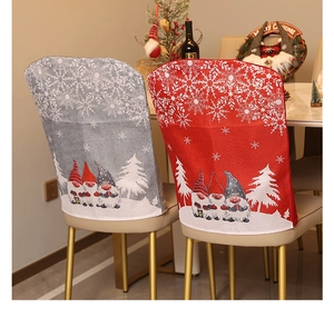 Festive Christmas chair covers with gnome and snowflake patterns in a cozy dining setting