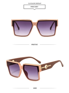 Detail of square oversized sunglasses with pink frames and purple gradient lenses