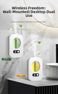 Wall-mounted smart fragrance diffuser with LED display in a modern marble bathroom setting
