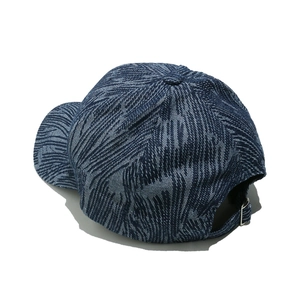 Detail of blue striped denim baseball cap featuring an adjustable silver metal buckle strap
