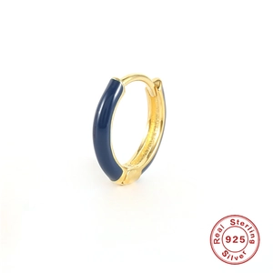 Detailed macro view of S925 sterling silver gold-plated hoop with dark blue enamel oil drop