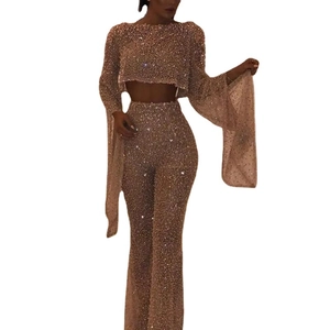 Sexy rose gold sequin two-piece set featuring long sleeve crop top and flared pants