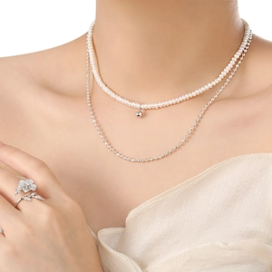 Double-layer natural freshwater pearl necklace with silver flower ring on model