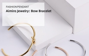Minimalist knot cuff bracelets in gold, silver, and rose gold on white display blocks