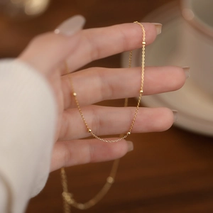 Elegant s925 sterling silver bead necklace in gold finish with a delicate chain design
