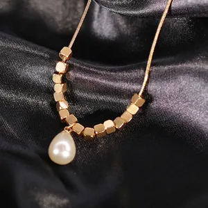 Minimalist gold titanium steel necklace with small squares and white pearl drop pendant