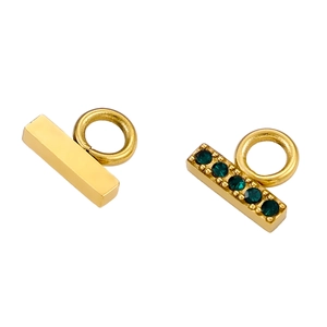 Detail of gold rectangular pendants featuring one plain surface and one with green gemstone