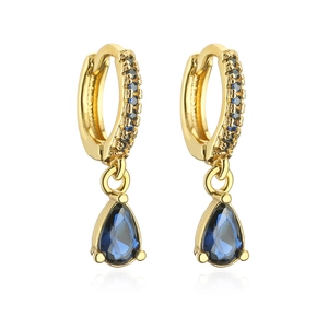 Detail of 18K gold hoop earrings with pave blue zircon and teardrop gemstone pendant