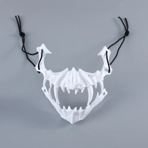 Close-up of white skeletal tiger mask with sharp fangs and elastic straps for cosplay