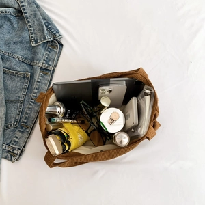 Caramel corduroy tote bag showing large capacity with tablet and daily essentials