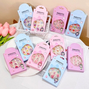 Detail of waterproof cartoon nail stickers for kids in cute pink and blue packaging
