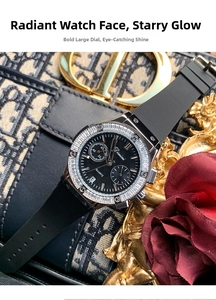 Detail view of the black quartz watch face with date window and diamond-set bezel