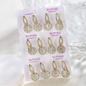 Detailed set of six pairs of gold-plated hollow floral earrings with white cubic zirconia