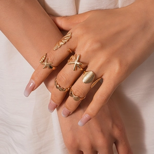 7pcs gold geometric rings set with starfish and shell charms for beach vacation