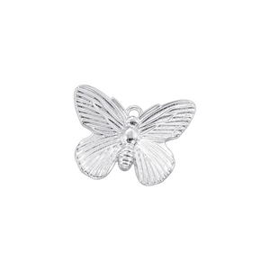 Detailed view of a silver butterfly pendant with intricate textured metal surface