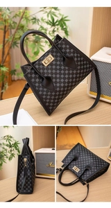 Detail view of mini Kelly bag with retro geometric logo pattern and golden twist lock