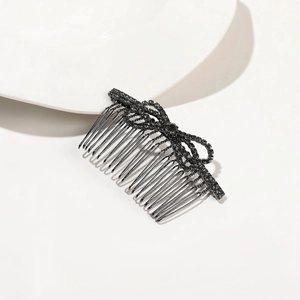 Close-up of golden leaf metal headband with intricate details for wedding hair styling