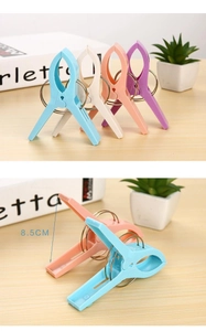 Detail view of 8.5cm large windproof clothespins with strong metal springs in macaron colors