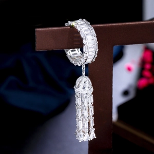 Luxury silver-tone tassel drop earrings with cubic zirconia micro-pave on a display stand