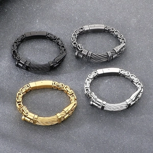 Detail view of woven steel nail bracelets in gold, silver, black, and gunmetal finishes