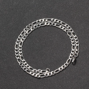 Close-up of 5mm Figaro chain necklace in polished silver stainless steel with lobster clasp