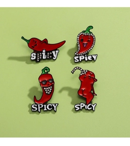 Detail view of 4-piece red enamel chili brooch set with SPICY text and rhinestones