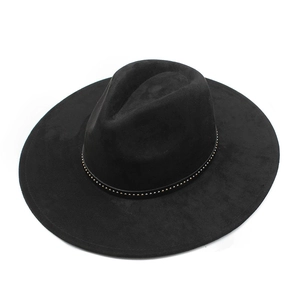 Detail of black wide brim felt hat with a gold-studded decorative band and wool texture