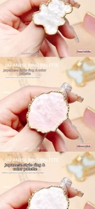 Detail of bear and wavy resin nail art palette rings with gold trim and agate texture