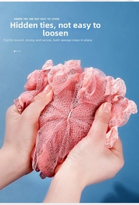 Detail of pink PE mesh bath ball with hidden ties showing durable structure