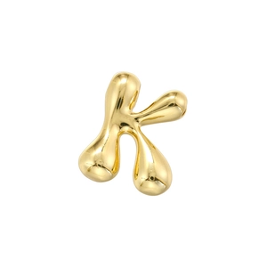 Polished gold liquid bubble letter K pendant with organic metal texture detail