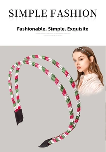 Detail of red green and white rhinestone double headband for Christmas party hair styling