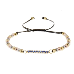 Adjustable bracelet with tri-color beads and a central row of blue cubic zirconia stones