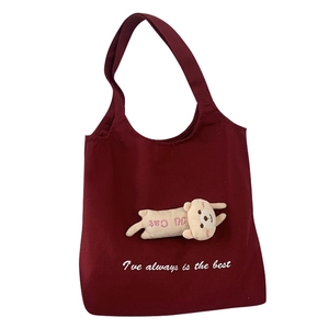Cute burgundy canvas tote bag with a plush cat doll and literary print for women