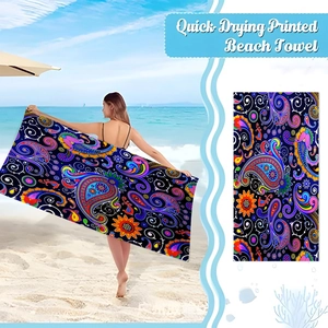 Detail of bohemian paisley microfiber beach towel with vibrant colors and quick-dry texture