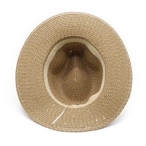 Detail of woven straw sun hat interior with beige sweatband and adjustable drawstring