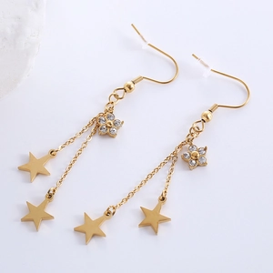 Detail of gold-tone star and rhinestone flower drop earrings with fishhook ear wires