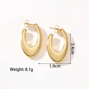 Detailed macro view of 18k gold-plated hollow U-shape hoop earrings in polished steel