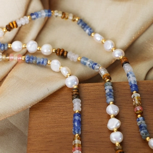 Bohemian style necklace with freshwater pearls, blue stones and tiger eye beads