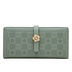 Detail of floral metal clasp on long faux leather floral print wallet in light green