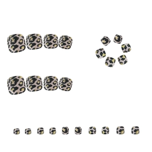 Leopard print press-on toenails with gold foil and black spots on beige base set