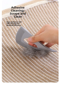 Detail of high-adhesion soft TPR scraper cleaning pet hair from a beige carpet surface