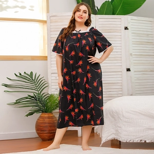 Detail view of plus size nightgown featuring floral print and white lace trim detail