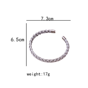 Technical sketch of silver knotted open cuff bracelet with dimensions 7.3cm x 6.5cm